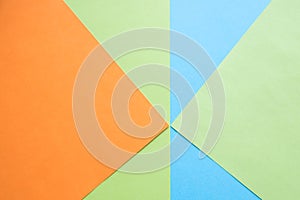 Color papers geometry flat composition background with green, orange and blue tones.New Minimal Flat design. Colorful