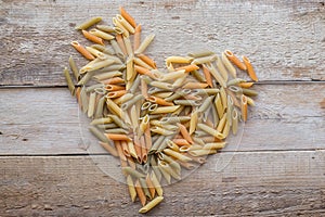 Color pasta on a wooden table