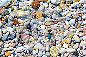 Color pebbles under sea water