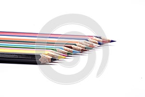 Color pencils arranged on a isolated white background