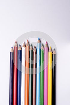 Color pencils arranged on a isolated white background