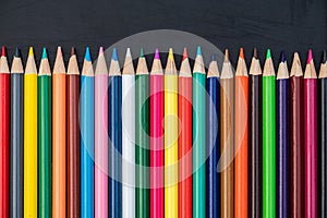 Color pencils on black chalkboard background