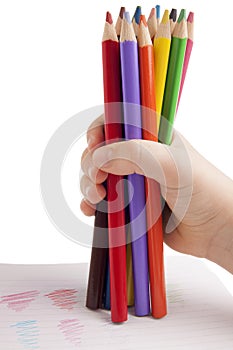 Color pencils in child hand photo