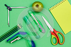 Color pencils, compass, stapler, felt-tip pen, paper knife, apple, scissors and notebook