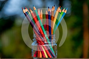 Color pencils in glass jar