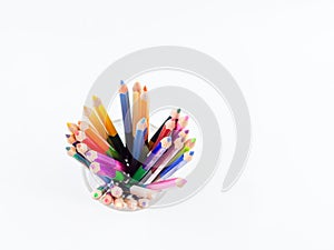 Color pencils is in a glass on white background, Top view,