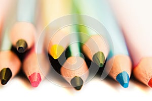 Color pencils isolated on white background, macro view.