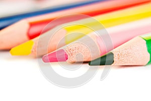 Color pencils isolated on white background, macro view.