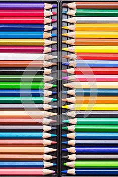 Color Pencils with plastic case isolated on Black Background clo