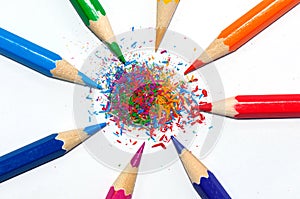 color pencils in a radial shape and crayon shaving