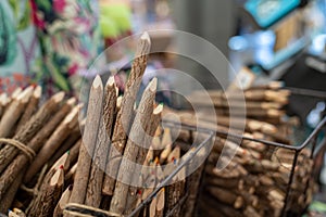 Color pencils styled as rustic wood sitting in baskets for sale