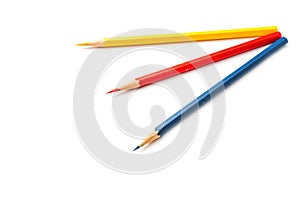 Color pencils, yellow, blue, red, isolated on white, on eyes level