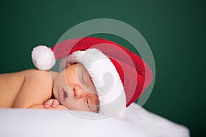 Christmas Newborn Baby Wearing Santa Hat and Sleeping