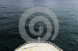 A color photo of the front of a cruise ship during a voyage.