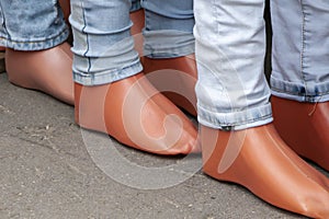 Color photo of legs of mannequins dressed in various jeans photo