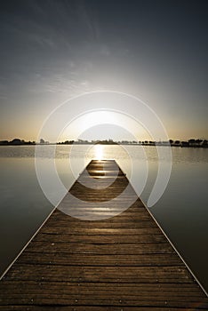 Color photography, pier at sunrise in a park of Manresa photo