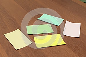 Color picker cards with names lie on the table surface, selective focus