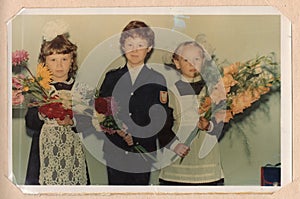 Color portrait photograph of schoolchildren.