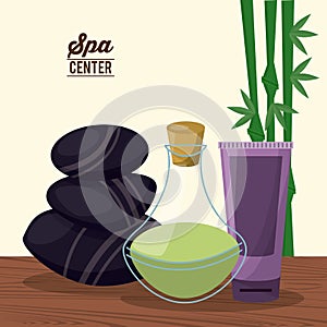 Color poster of spa center with bamboo plant and herbal essence bottle and lava stones and facial cream