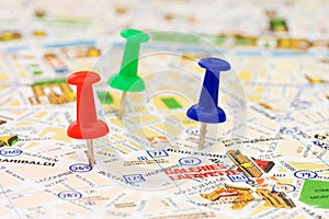 Color pushpins marking a location photo