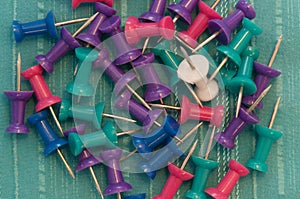 Color Pushpins On Teal