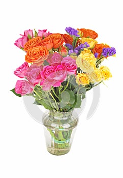 Color roses bouquet in glass vase.