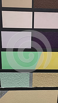 Color samples of decorative plasters at the store