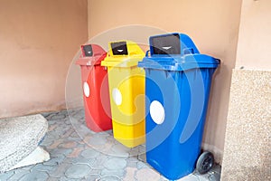 Color-segregated bins for proper waste separation