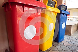 Color-segregated bins for proper waste separation