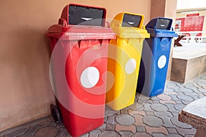 Color-segregated bins for proper waste separation