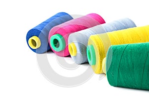 Color sewing threads on white background
