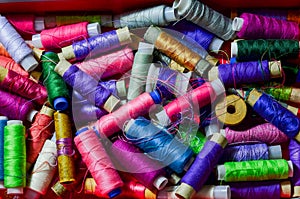 Color sewing threads on white background
