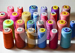 Color sewing threads on white background