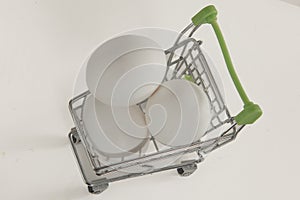 Eggs isolated in a toy cart on a white background. egg. murgi ke andai. koli muttai. photo