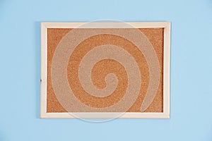 Color shot of a brown cork board in a frame