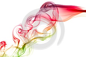 Color smoke flowing over white background . abstract .