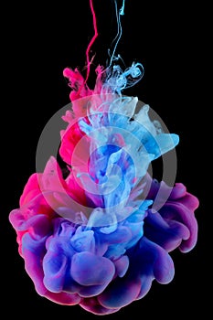 Color splash of ink in water on black background