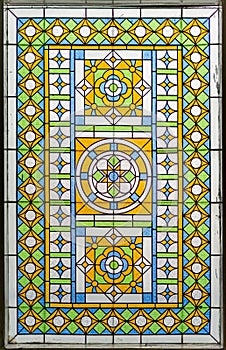 Color Stained Glass At Window. Bright Colorful Classic Blue Green Orange Glass Texture and Background.