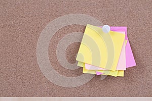 Color sticky note on cork board with blank notes, empty space for text