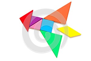 Color tangram puzzle in rocket shape on white background