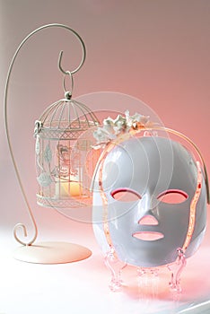 Color therapy mask, candle holder on background