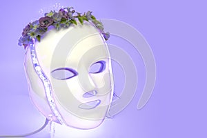 Color therapy mask glowing light purple, flowers