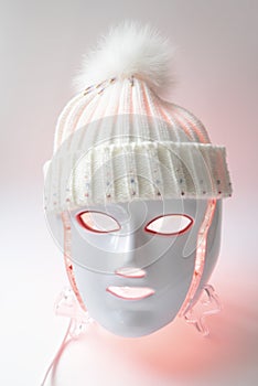 Color therapy mask glowing pink with hat