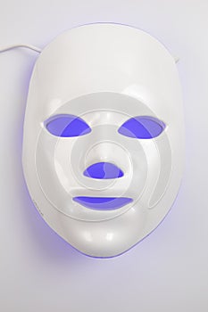 Color therapy mask glowing on the white background