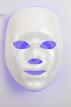 Color therapy mask glowing on the white background