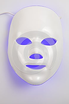 Color therapy mask glowing on the white background