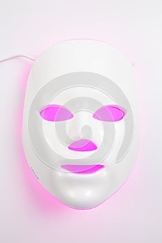 Color therapy mask glowing on the white background