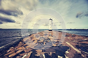 Color toned picture of old lighthouse in Swinoujscie, Poland