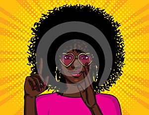 Color vector illustration in pop art style. African American girl shows thumb up. A girl with pink glasses wants to tell a secret.