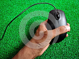 Color wired computer mouse. Isolated on green background